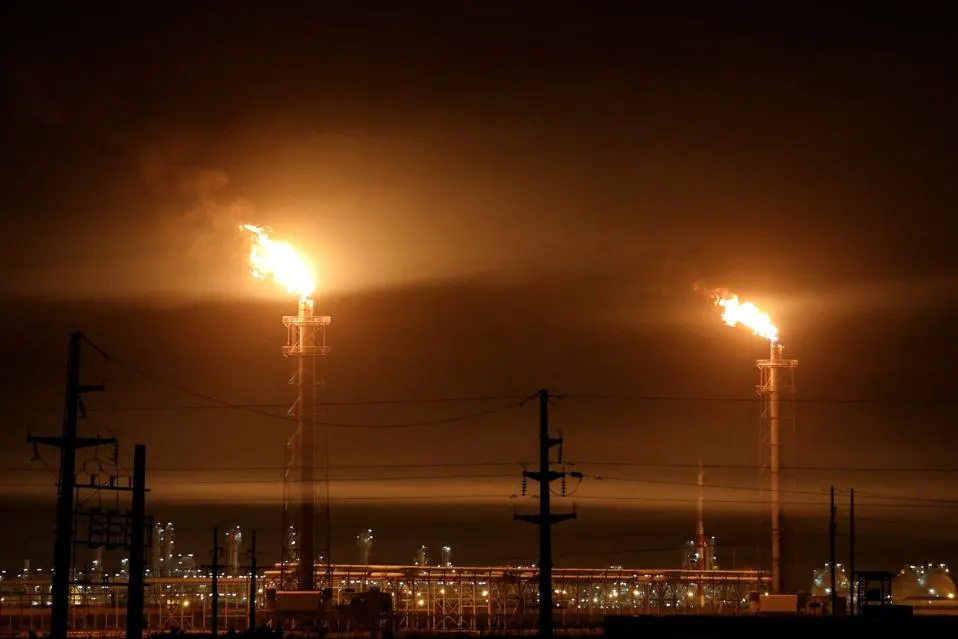 Gas flares at an oil refinery near Iraq's receding marshes of Hawizeh, which straddle the border with Iran, in the southeastern Missan province on April 25, 2025. (Photo by Asaad NIAZI / AFP) (Photo by ASAAD NIAZI/AFP via Getty Images)<br/>... More<br/>AFP via Getty Images